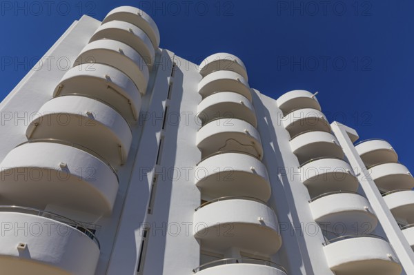 Modern holiday flats with round balconies at the harbour of Santa Eularia, Ibiza, Balearic Islands, Mediterranean Sea, Spain, Europe