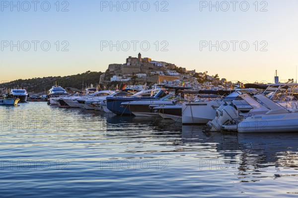 Luxury yachts in the harbour, behind the fortress and the old town of Eivissa, Ibiza Town, Ibiza City, Ibiza, Balearic Islands, Mediterranean Sea, Spain, Europe