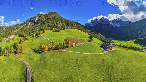 Farm and alpine meadows, in the background the peaks of the Geisler group, panoramic shot, drone shot, Sankt Magdalena, Villnößtal, Dolomites, Autonomous Province of Bolzano, South Tyrol, Italy, Europe