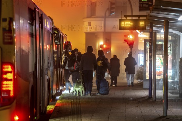 Bus stop, in the fog, passengers boarding a bus, autumn, winter, Essen, North Rhine-Westphalia, Germany, Europe