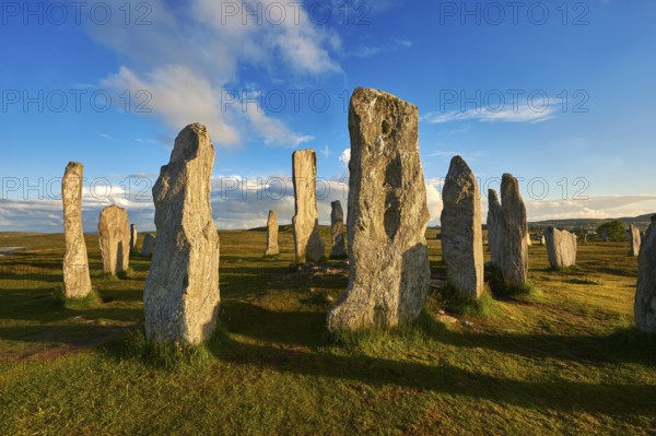 Calanais Standing Stones central stone circle erected between 2900-2600BC measuring 11 metres wide. At the centre of the ring stands a huge monolith stone 4. 8 metres high weighing about 7 tonnes, which is perfectly orientated so that its widest sides f