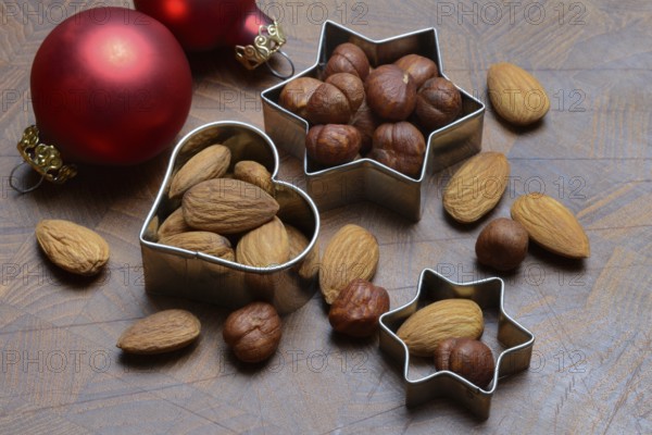 Nuts and cookie cutters, almonds and hazelnuts