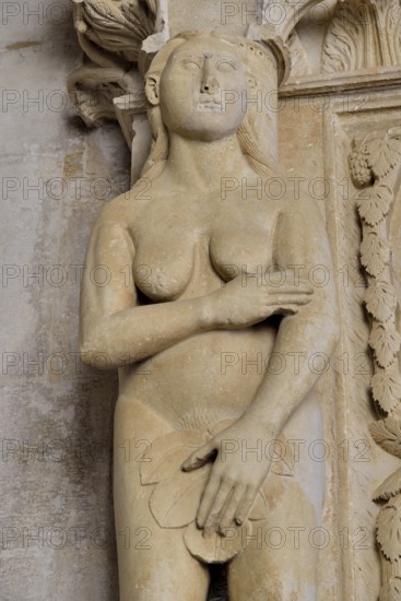 Eve with a fig leaf on the western gate of Trogir Cathedral or Cathedral of St. Lawrence, 13th century, by the artist Radovan, historic centre, Unesco World Heritage Site, Trogir, Dalmatia, Croatia, Europe