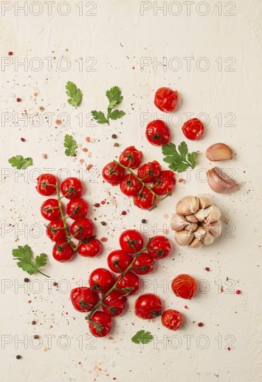 Baked branch, mini, cherry tomatoes, with spices and herbs, garlic, food background, top view, on a white background