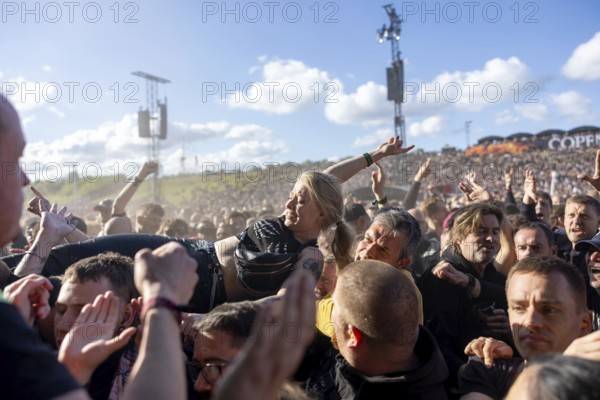 Copenhagen, Denmark - 19.6.2024: Festivalgoers crowdsurfing at the Copenhell Metal Festival at Kløverparken Camping Copenhagen, Denmark. The festival will take place from 19-22 June 2024