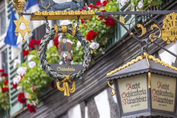 Nose sign in the old town centre of Bamberg. Brewer's star, guild symbol of the brewers. Schlenkerla smoked beer brewery. Bamberg, Upper Franconia, Bavaria, Germany, Europe