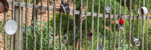 Traditional wooden fence, farm fence, decorated with old pots and utensils, rural idyll, country life, Langenstein, Harz, Saxony-Anhalt, Germany, Europe