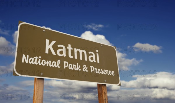 Katmai national park and preserve (alaska) road sign against blue sky and clouds