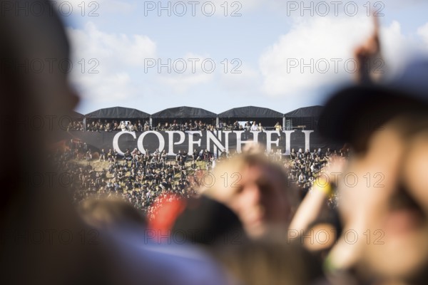 Festival visitors and logo at the Copenhell Metal Festival at Kløverparken Camping Copenhagen, Denmark. The festival will take place from 19-22 June 2024