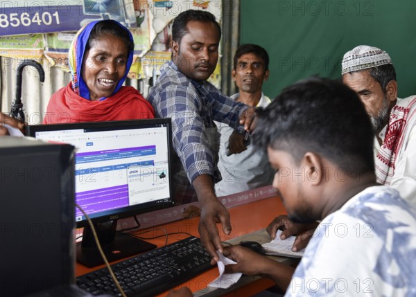 People checks their names in a roadside DTP centre, in the published final list of National Register of Citizens (NRC), in Morigaon district of Assam, India on 31 August 2019