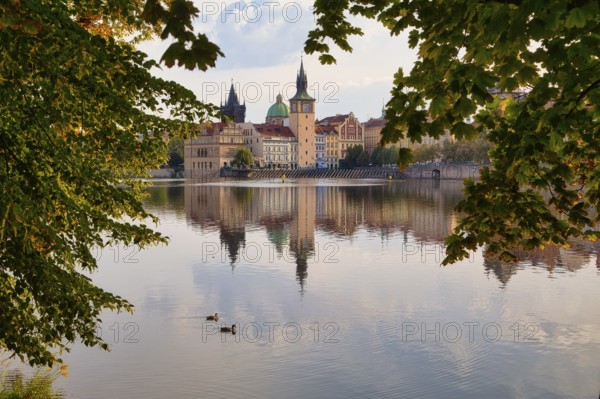 Strelecky Island in the Vltava River and the Old Town of Prague, Czech Republic, Europe