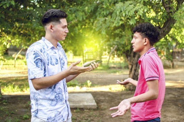 Young man chatting with young man, two people arguing WITH COPY SPACE