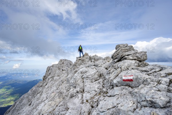 Mountaineer on a narrow rocky ridge, Watzmann crossing to Watzmann Mittelspitze, view of mountain panorama, Berchtesgaden National Park, Berchtesgaden Alps, Bavaria, Germany, Europe