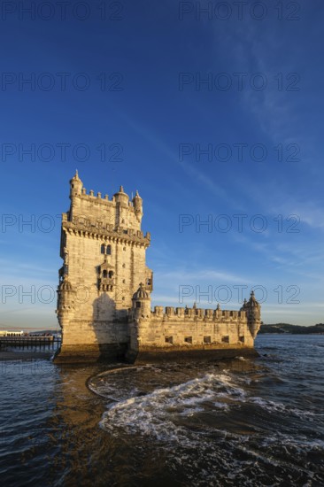 Belem Tower or Tower of St Vincent, famous tourist landmark of Lisboa and tourism attraction, on the bank of the Tagus River Tejo on sunset. Lisbon, Portugal, Europe