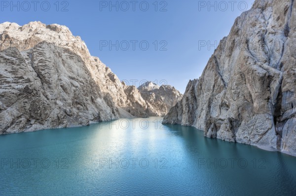 Turquoise mountain lake Kol Suu with rocky steep mountains, Kol Suu Lake, Sary Beles Mountains, Naryn Province, Kyrgyzstan, Asia