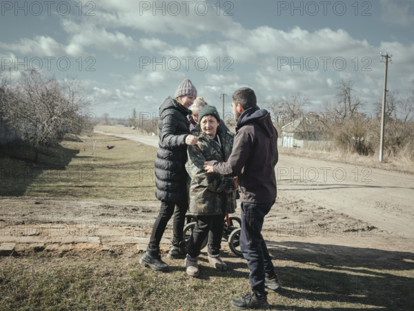 Welcoming relatives in a village near the front, Voloska Balakliia, Ukraine, Europe