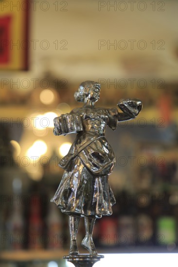 Antique beer pump metal female figure, inside famous historic Los Gatos Cervecerias bar, Madrid, Spain, Europe