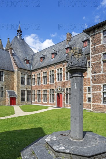 1758 pillory in courtyard at Kasteel van Laarne, 14th century medieval moated castle near Ghent, East Flanders, Belgium, Europe