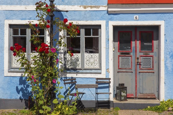 Façade of traditional house in blue pastel colour in the town Ystad in summer, Skåne, Scania, Sweden, Europe