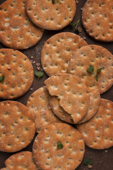 Crispbread, round, with salt and herbs, top view, food concept, no people