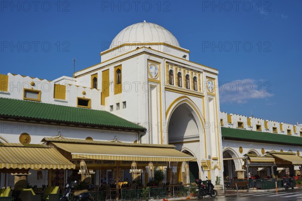 Market Hall, Nea Agora, Large building with dome and market square, Greek architecture with yellow and white details under bright sunshine, Rhodes Old Town, Rhodes Town, Rhodes, Dodecanese, Greek Islands, Greece, Europe