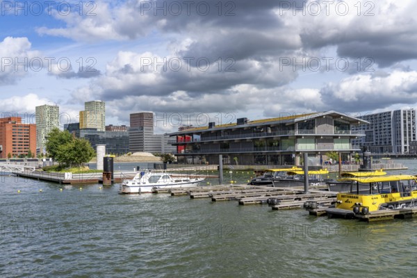 The Floating Office Rotterdam, is considered the world's largest floating office building, first part of the floating park, in the Rijnhaven, 28ha harbour basin, has now been filled in by almost a third to create space for up to 3000 flats, there will be an artificial beach, a floating park connected by jetties, restaurants and shops, cultural facilities, a major urban development project in the old harbour, the Rijnhaven is adjacent to the popular districts of Kop van Zuid and Katendrecht, Rotterdam, Netherlands