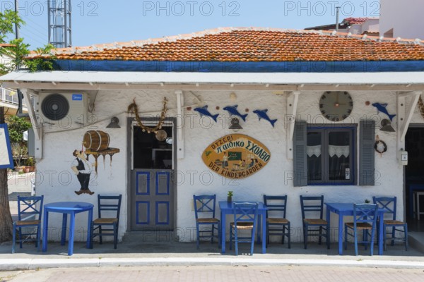 Mediterranean restaurant with murals, blue chairs and traditional outdoor decoration, Sarti, Sithonia, Chalkidiki, Halkidiki, Central Macedonia, Greece, Europe