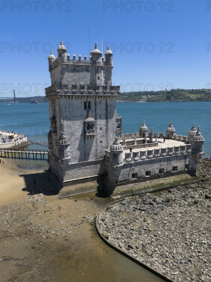 Historic tower on the rocky shore with a view of the sea and blue sky, aerial view, Torre de Belém, World Heritage Site, Belem, Bethlehem, Lisbon, Lisboa, Tagus River, Portugal, Europe