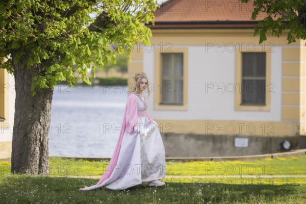 Cinderella can also be seen around Moritzburg Castle in spring. Model Tamara Kretschmer once again slipped into the coveted role of the legendary Cinderella with the ball gown, Moritzburg, Saxony, Germany, Europe