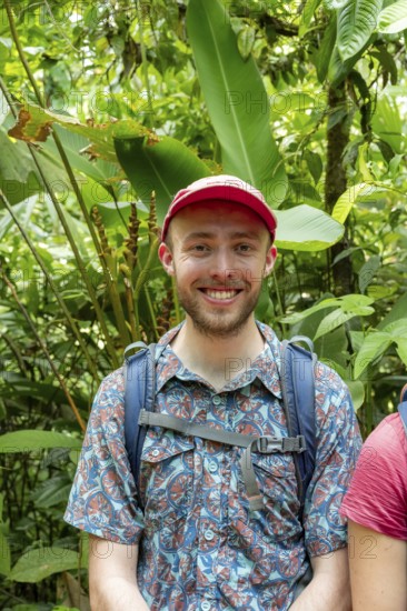 Tourist in the tropical rainforest, portrait, Corcovado National Park, Osa Peninsula, Puntarena Province, Costa Rica, Central America