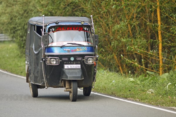 Traditional tuk tuk on the road, Thekkady, Kerala, India, Asia