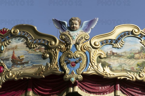 Deatil of an angel on a historical carousel, Rome, Italy, Europe