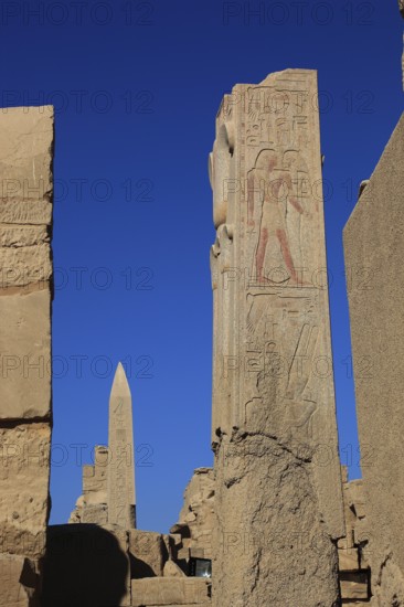 Luxor, Karnak Temple, obelisk and columns with depictions in the temple complex in Karnak, Africa, Upper Egypt, UNESCO World Heritage Site