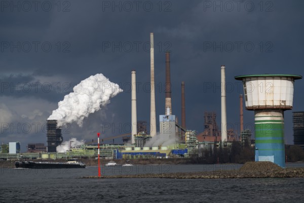 Rhine at Duisburg Bruckhausen, Marxloh, Thyssenkrupp Steel steelworks, blast furnaces, sintering plant, discharge plume of the Schwelgern coking plant, well tower of the Walsum waterworks, Duisburg, North Rhine-Westphalia, Germany, Europe