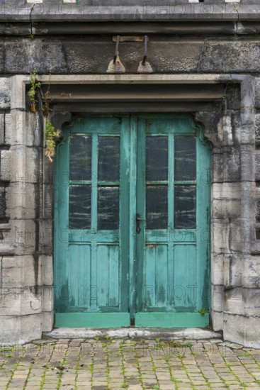 Old dilapidated turquoise-coloured door, wood, wooden door, paint, peeled off, green, entrance door