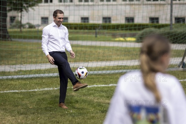 Philipp Lahm, former German football player, photographed playing football during the presentation of the UEFA European Football Championship 2024 coin and stamp at the Federal Ministry of Finance in Berlin, 21 May 2024. Photographed on behalf of the Federal Ministry of Finance