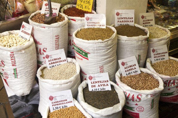 Sacks of beans and pulses on display in a market Barrio Macarena, Seville, Spain, Europe