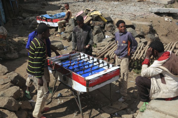 In the highlands of Abyssinia, in the Semien Mountains, Semien Mountains, village of Debark, young people playing table football, Ethiopia, Africa