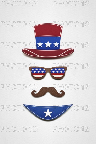 Creative 4th of July concept photo of Uncle Sam made of paper on a white background