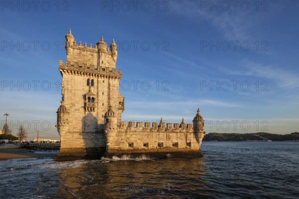 Belem Tower or Tower of St Vincent, famous tourist landmark of Lisboa and tourism attraction, on the bank of the Tagus River Tejo on sunset. Lisbon, Portugal, Europe