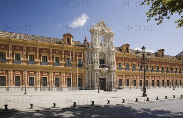 San Telmo palace building facade with columns at the entrance decorated with carved statues and sculptures, Seville, Spain, Europe