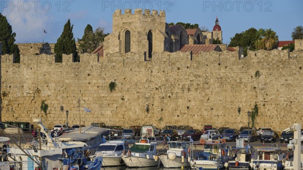 Historic city wall, tower, boats, harbour area, Rhodes town, Rhodes, Dodecanese, Greek islands, Greece, Europe