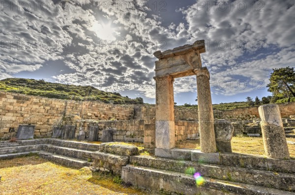 HDR, Super wide angle shot, Ancient ruins with stone walls and columns under a sunny sky with clouds, historical site, Ancient well house, Kamiros, Archaeological site, Ancient city, Foundation of Doric Greeks, Rhodes, Dodecanese, Greek Islands, Greece, Europe