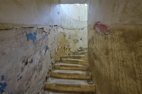 Dilapidated staircase with peeling paint and round window through which light enters, Lost Place, Former Santorium, Tuberculosis Centre 1947-1970, Former Italian colonial settlement, Eleousa, Campochiaro, Rhodes, Dodecanese, Greek Islands, Greece, Europe