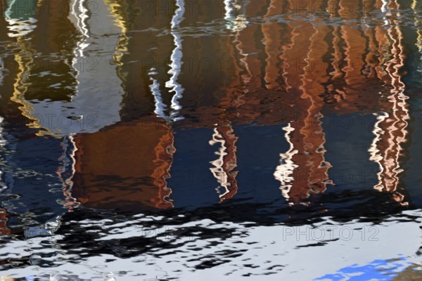 Reflection, colourful reflections on the water surface, maritime impressions, Greetsiel, North Sea, Lower Saxony, Germany, Europe