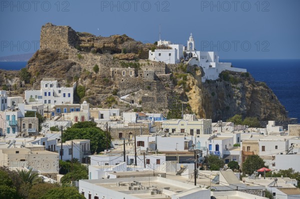 White painted houses and an old castle on a hill overlooking the blue ocean on a clear day, morning light, Panagia Spiliani, Castle, Mandraki, Nisyros, Dodecanese, Greek Islands, Greece, Europe