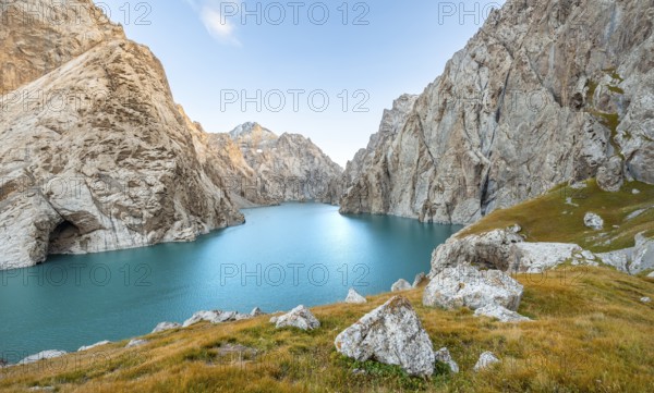 Turquoise mountain lake Kol Suu with rocky steep mountains, Kol Suu Lake, Sary Beles Mountains, Naryn Province, Kyrgyzstan, Asia