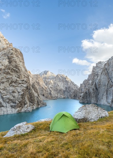 Green tent at the turquoise mountain lake Kol Suu with rocky steep mountains, Kol Suu Lake, Sary Beles Mountains, Naryn Province, Kyrgyzstan, Asia