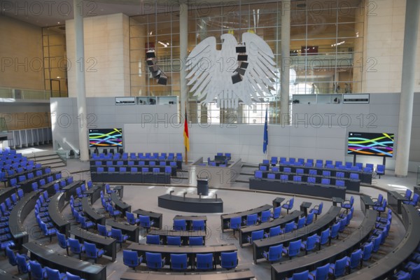 Symmetrical plenary chamber with blue chairs and large eagle as a central element, political ambience, Reichstag building, German Bundestag, Berlin, Germany, Europe