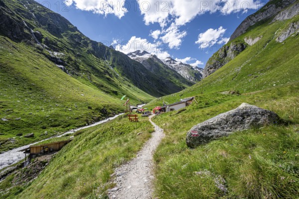 Mountain hut Clarahütte, Umbaltal with mountain stream Isel, glaciated mountain peaks in the background, Venediger Group, Hohe Tauern National Park, East Tyrol, Tyrol, Austria, Europe